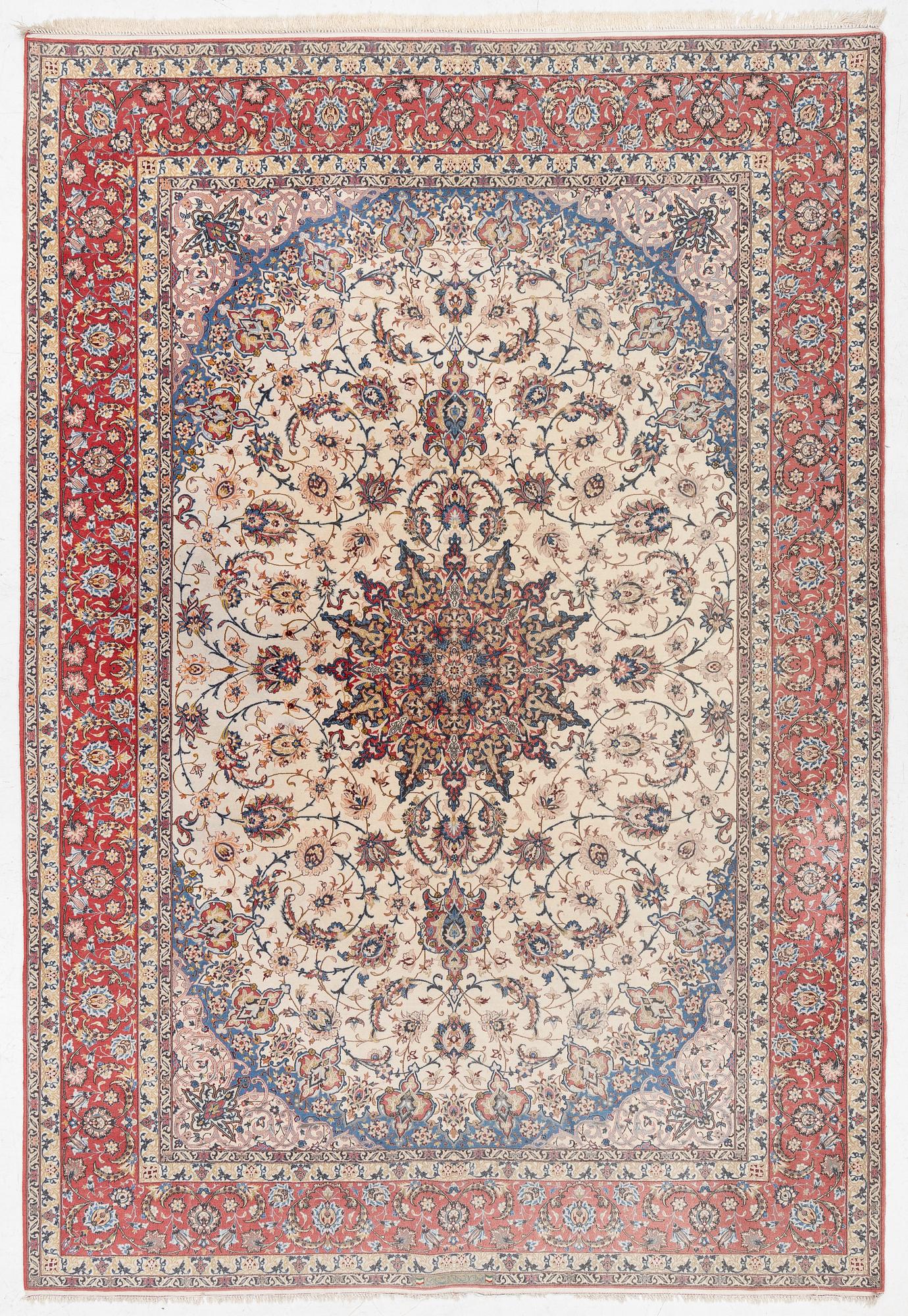 An Isfahan carpet, signed, approx. 372 x 255 cm.