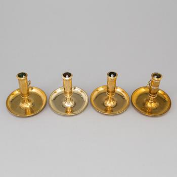 Four brass candlesticks from Skultuna and Svenska Metallverken, second half of the 20th Century.
