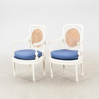 A pair of painted rattan Louis XVI style armchairs first half of the 20th century.