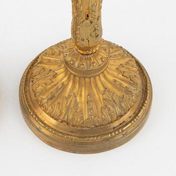 A pair of bronze candle sticks, 20th Century.