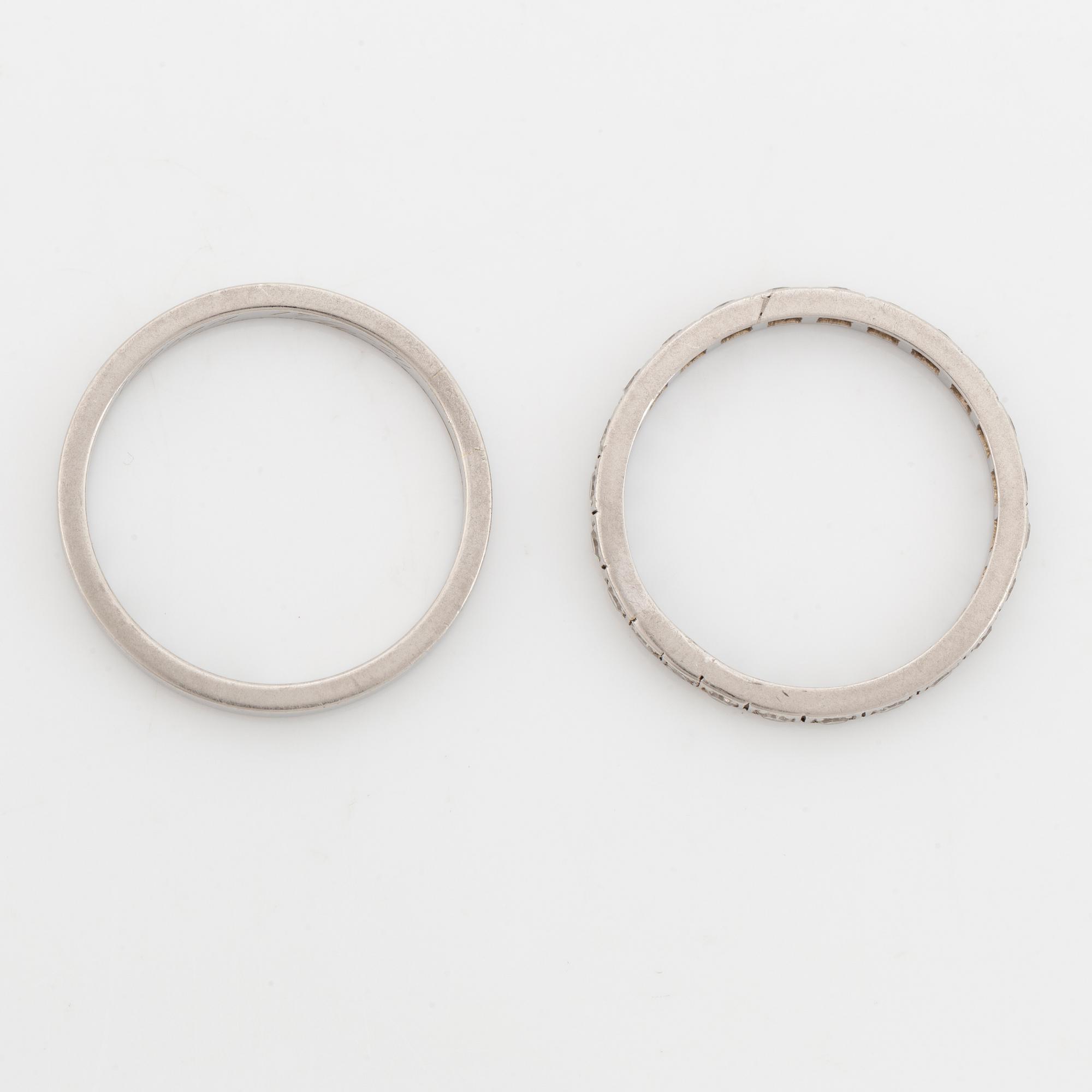 Two  platinum rings, one with eight cut diamonds.