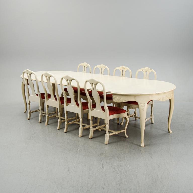 A rococo style dining set with a around table and eight chairs, 20th Century.