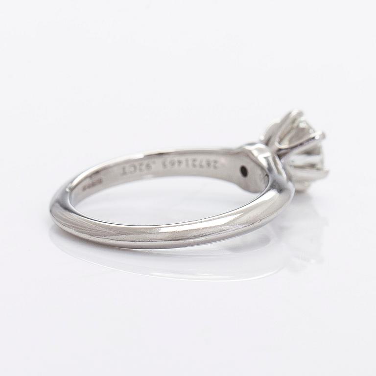 Tiffany & Co, a platinu solitaire ring with a brilliant-cut diamond.