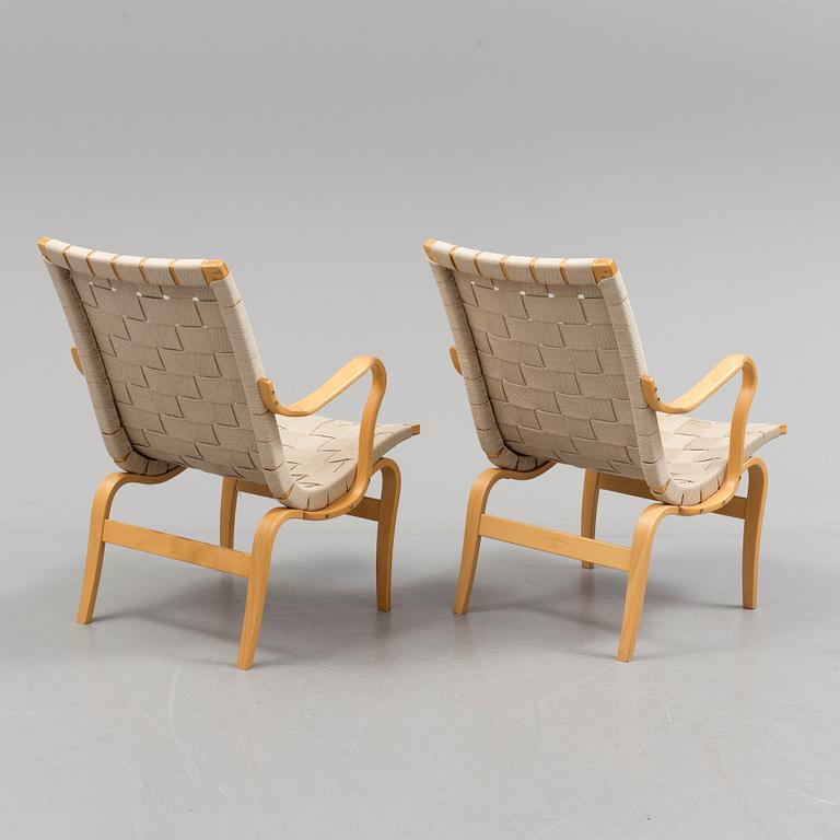 a pair of "Eva" armchairs by Bruno Matsson.