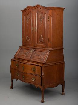 A TWO-PIECE WRITING CABINET.