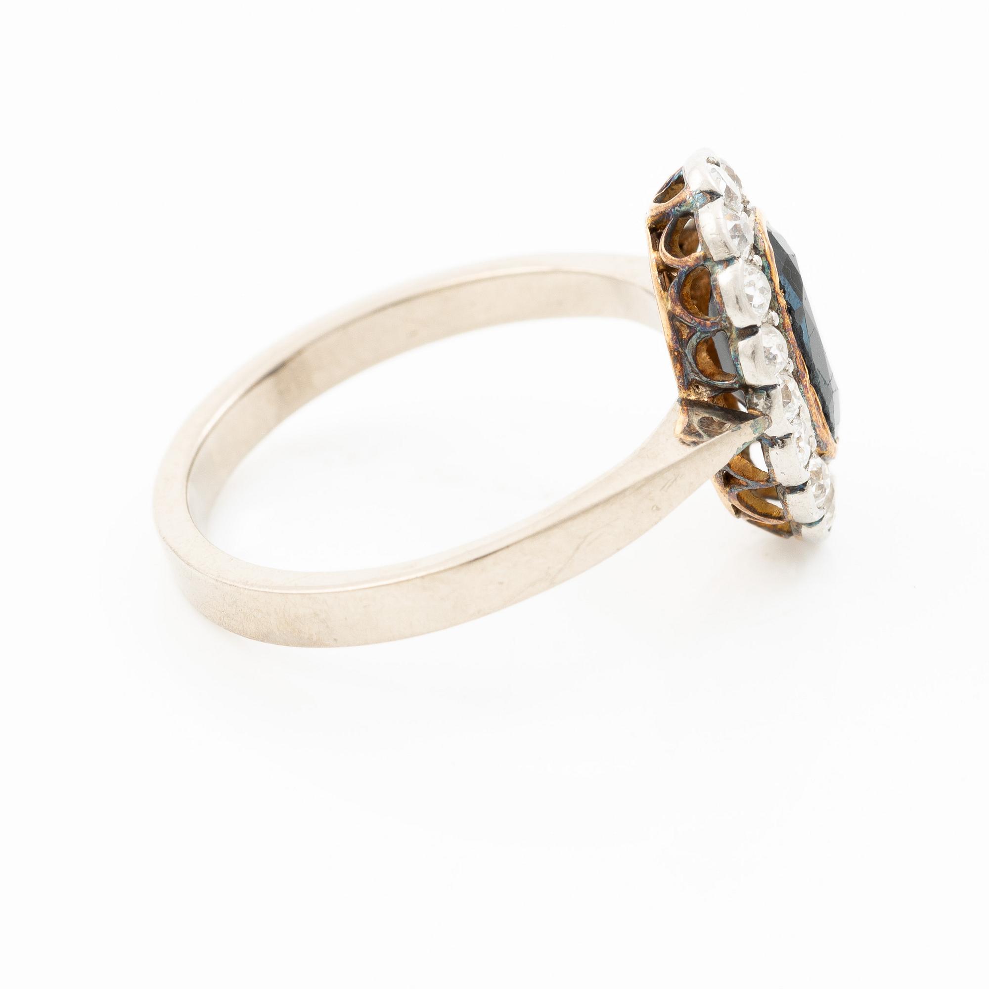 Ring, camrose model, 18K white gold with sapphire and old-cut diamonds.