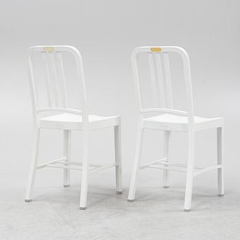 A pair of plastic 'Navy Chair' by Emeco.