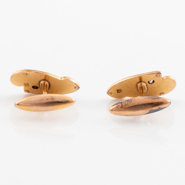 A pair of 14K gold cufflinks set with old-cut diamonds.