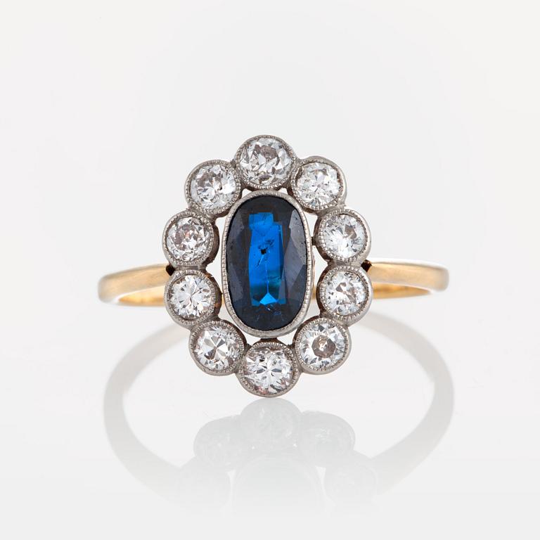 A sapphire ring in platinum and 18K gold set with old-cut diamonds.