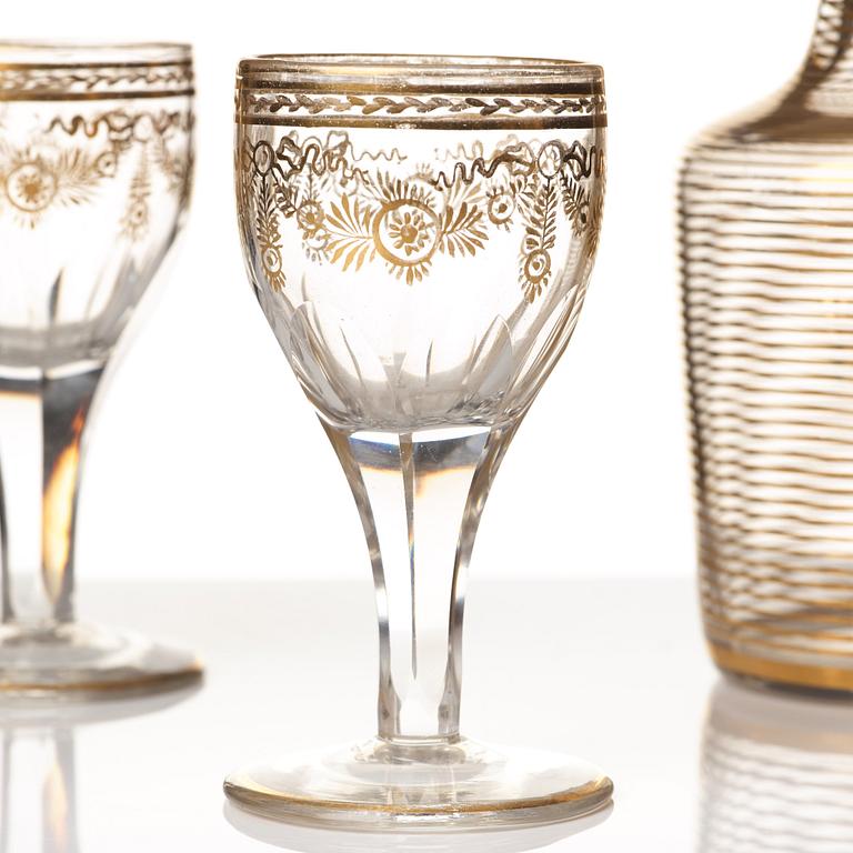 A set of six Russian glass goblets and a bottle with stopper, 19th Century.