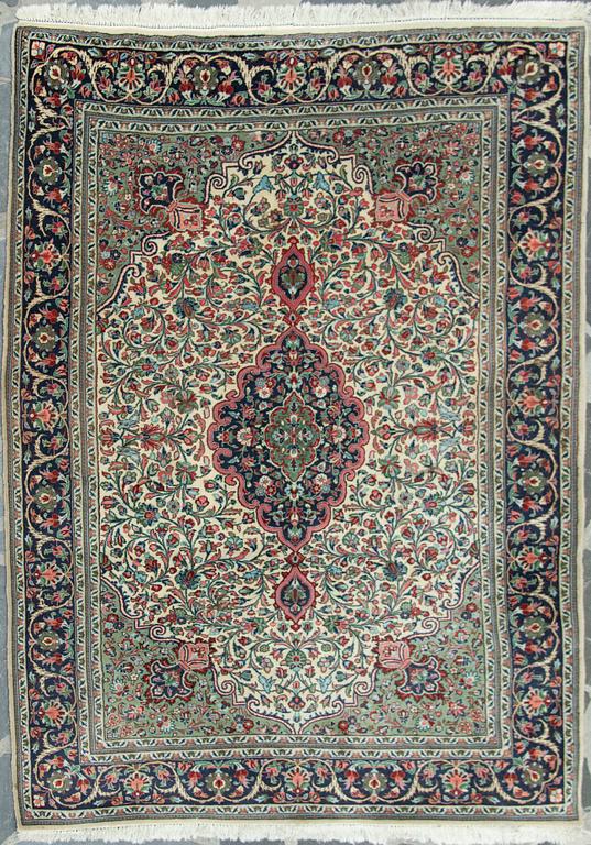 An oriental carpet. Ghom. Circa 208x147 cm.