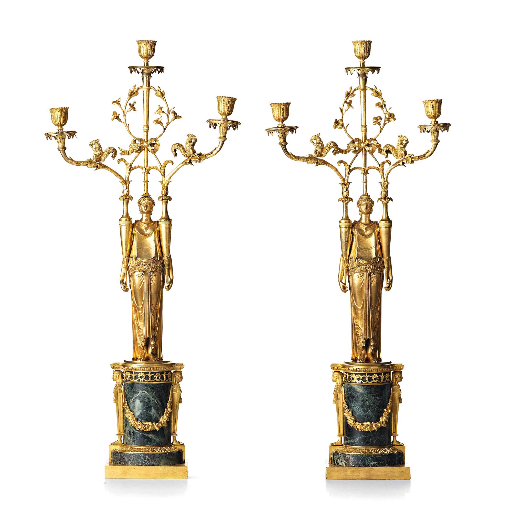 A pair of French Directoire three-light candelabra, circa 1800.