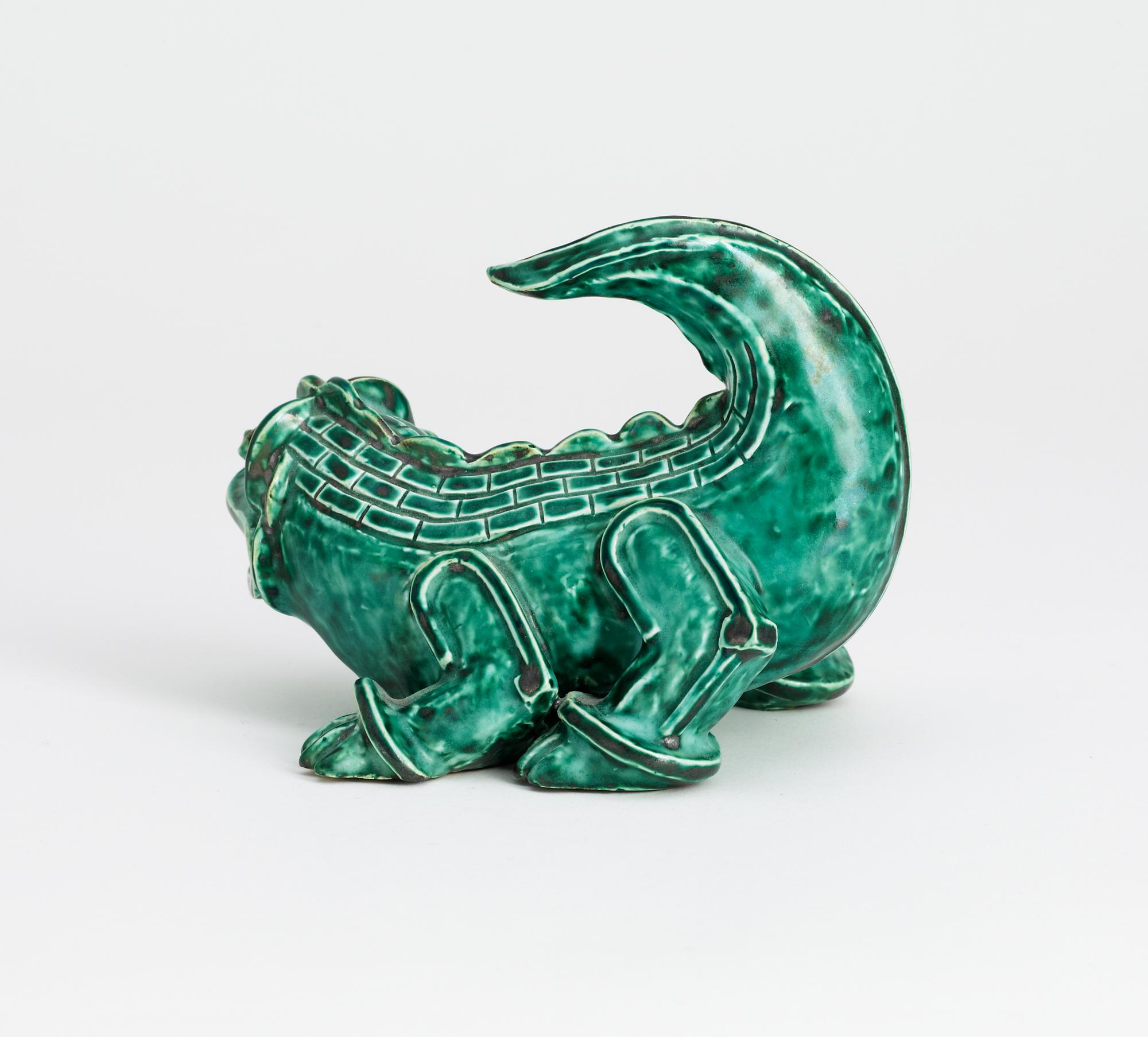 A Wilhelm Kåge stoneware figure of a dragon puppy, Gustavsberg circa 1940.