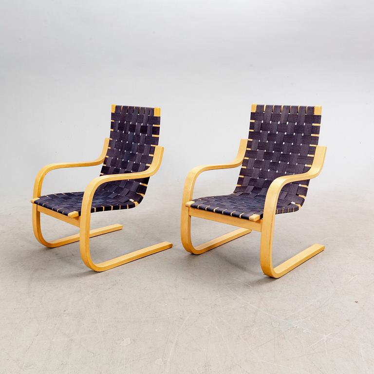 Alvar Aalto, a pair of birch armchairs model 406 21st century.