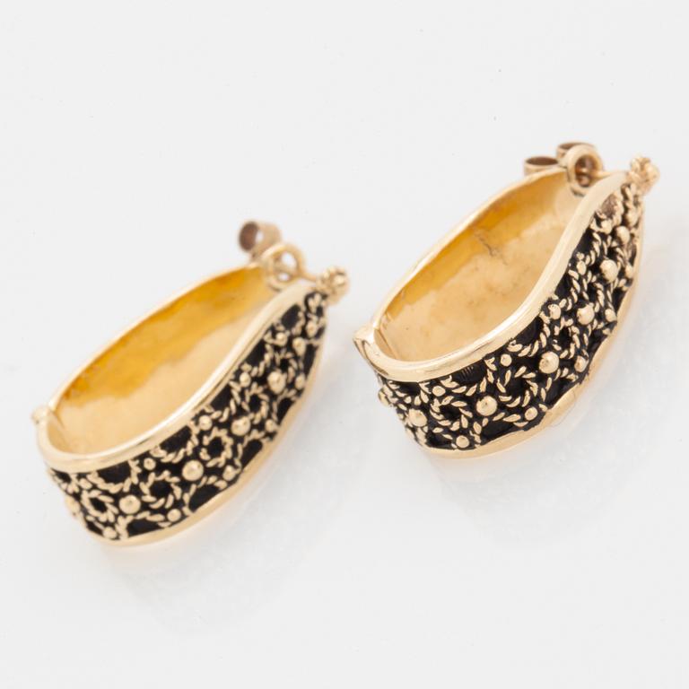 14K gold hoop earrings.