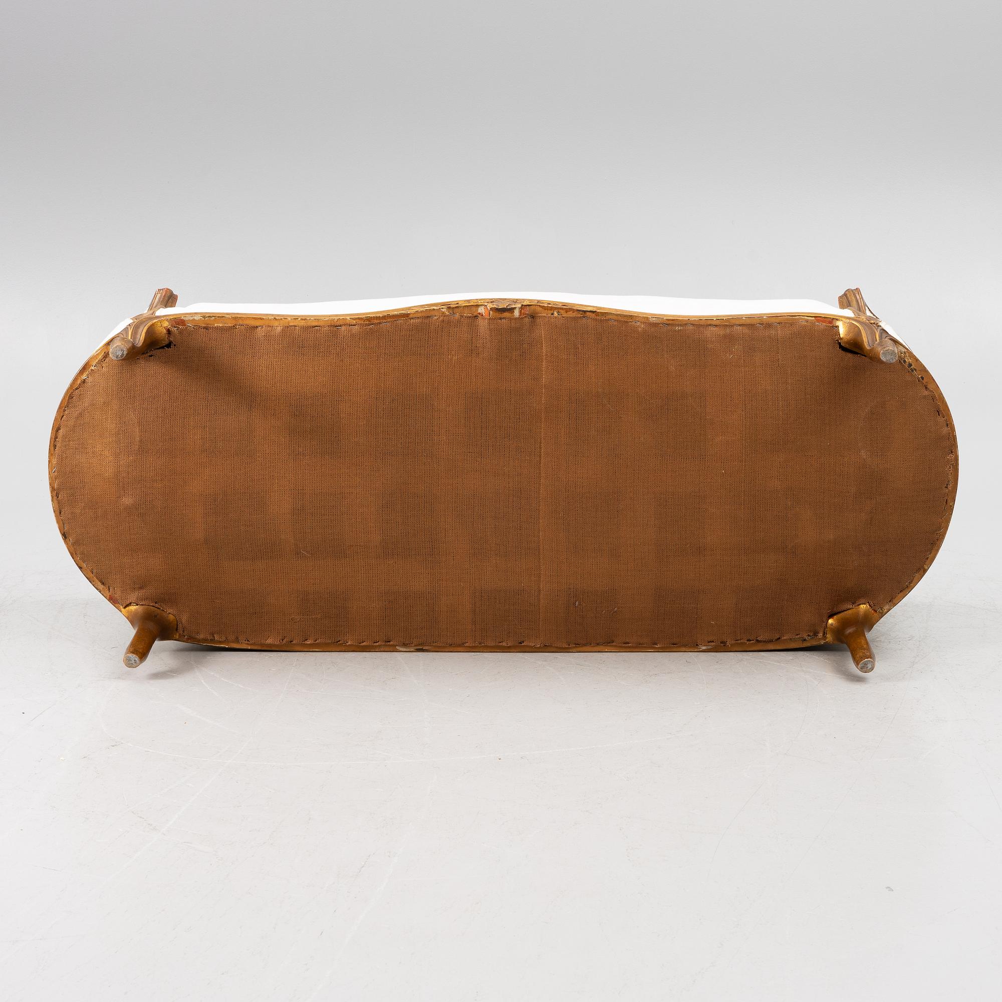 A Louis XV-style sofa, early 20th century.