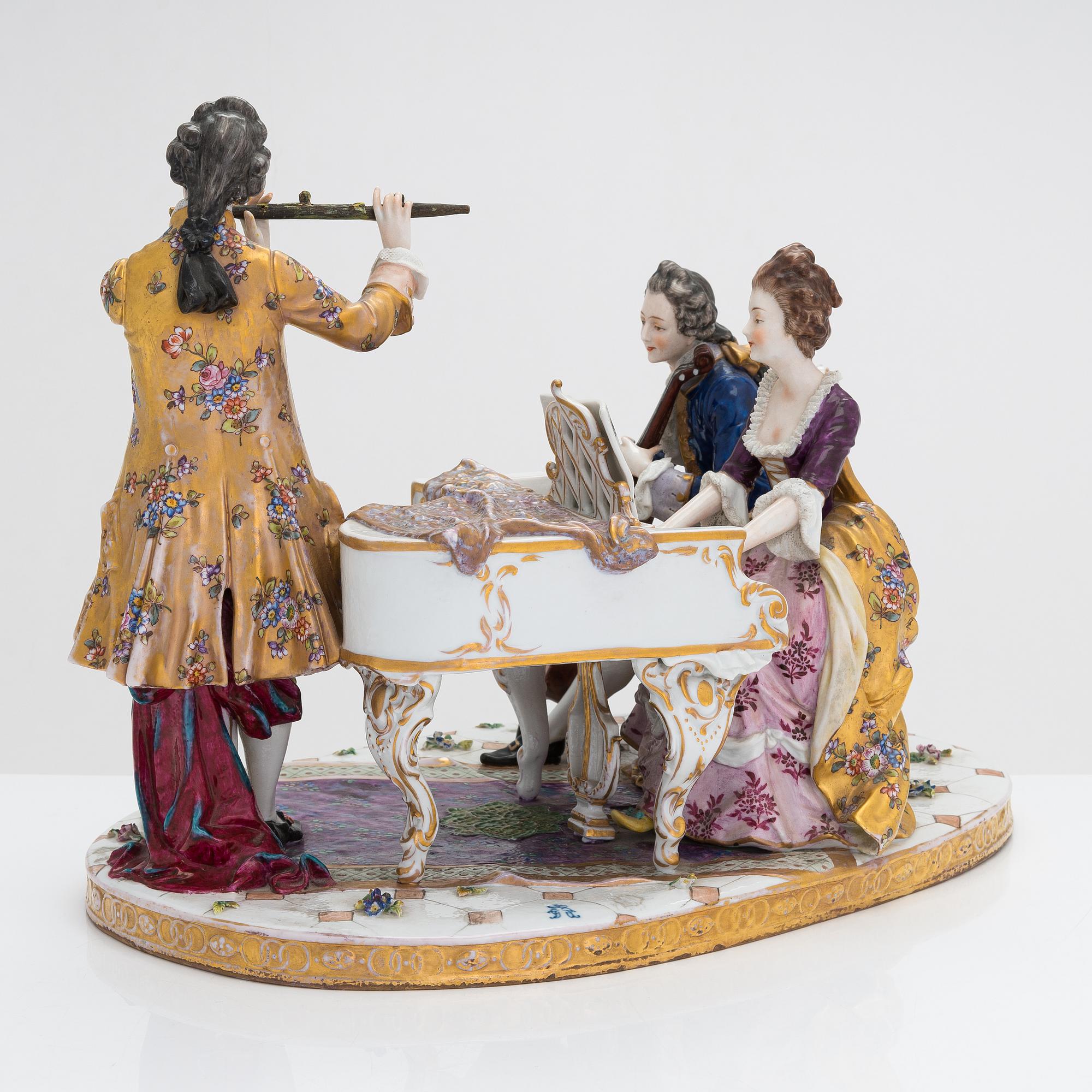 A Volkstedt porcelain musical trio figurine, mid-20th century. Length 40 cm.