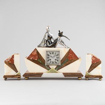 An Art Déco marble mantle clock and a pair of book ends, 1920's.