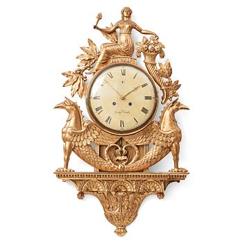 A Swedish Empire wall clock by G Undén.