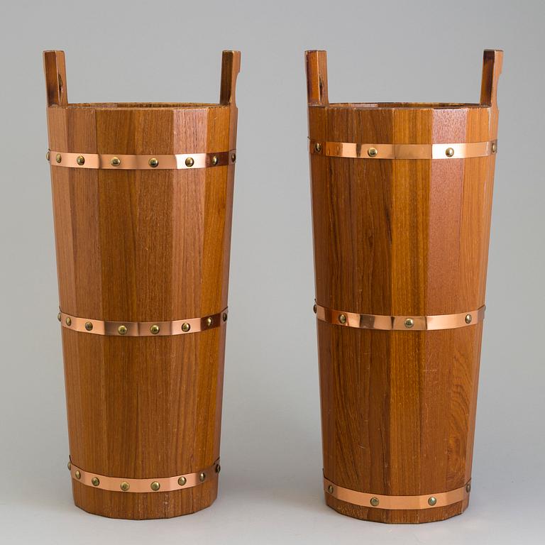 a pair of teak umbrella stands from the second half of the 20th century.