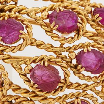 A 1950/60's brooch by Cartier, in the shape of a strawberry, set with carved rubies and brilliant cut diamonds.