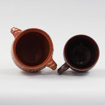 two earthenware pots from the 19th century.