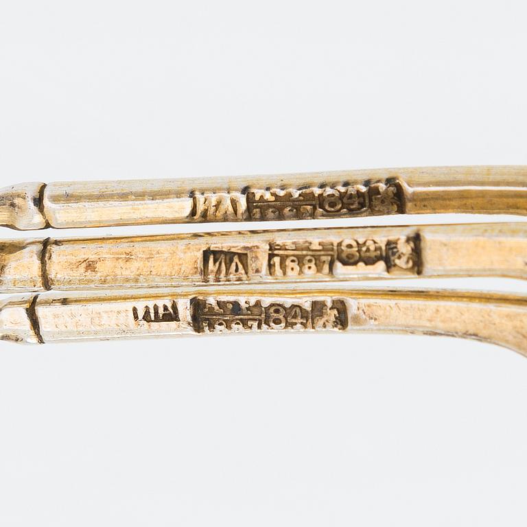 Twelve parcel-gilt teaspoons and a jam spoon, Russia 1887-1926.