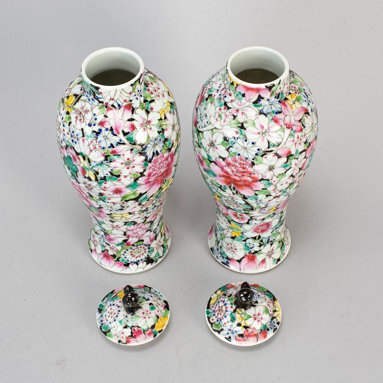 A pair of Chinese 'Mille fleur' porcelain vases with covers, 20th century.