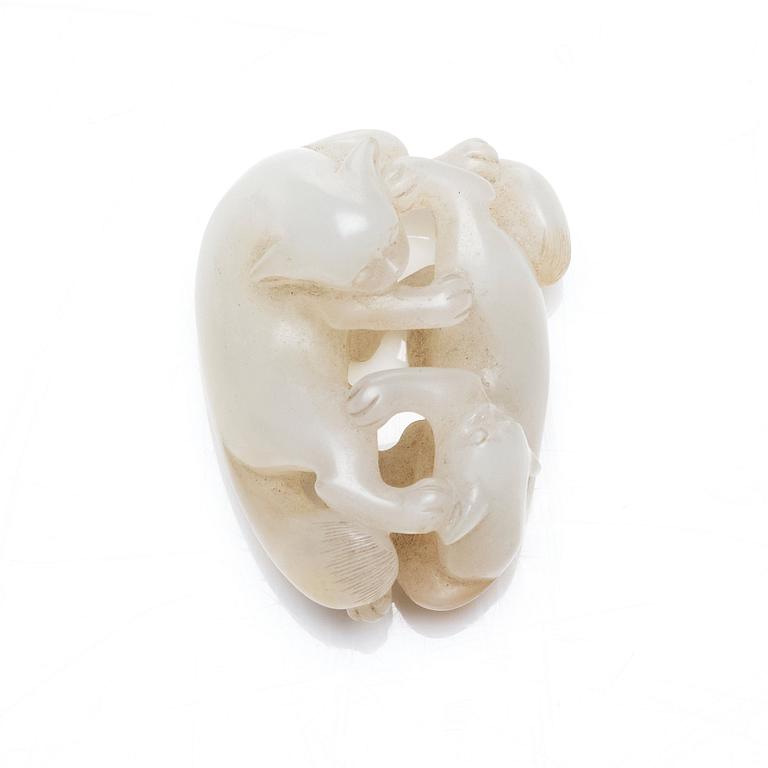 A nephrite figure of two mythical creatures, China, early 20th Century.