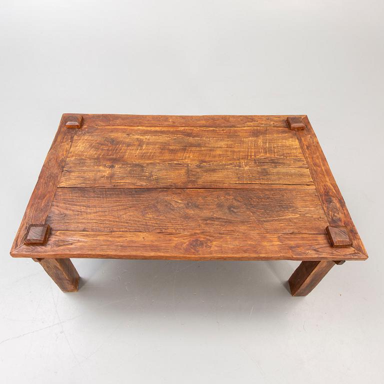 A wooden coffee table later part of the 20th century.