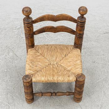 Charles Dudouyt, attributed to, a fireside low chair, mid 20th century.