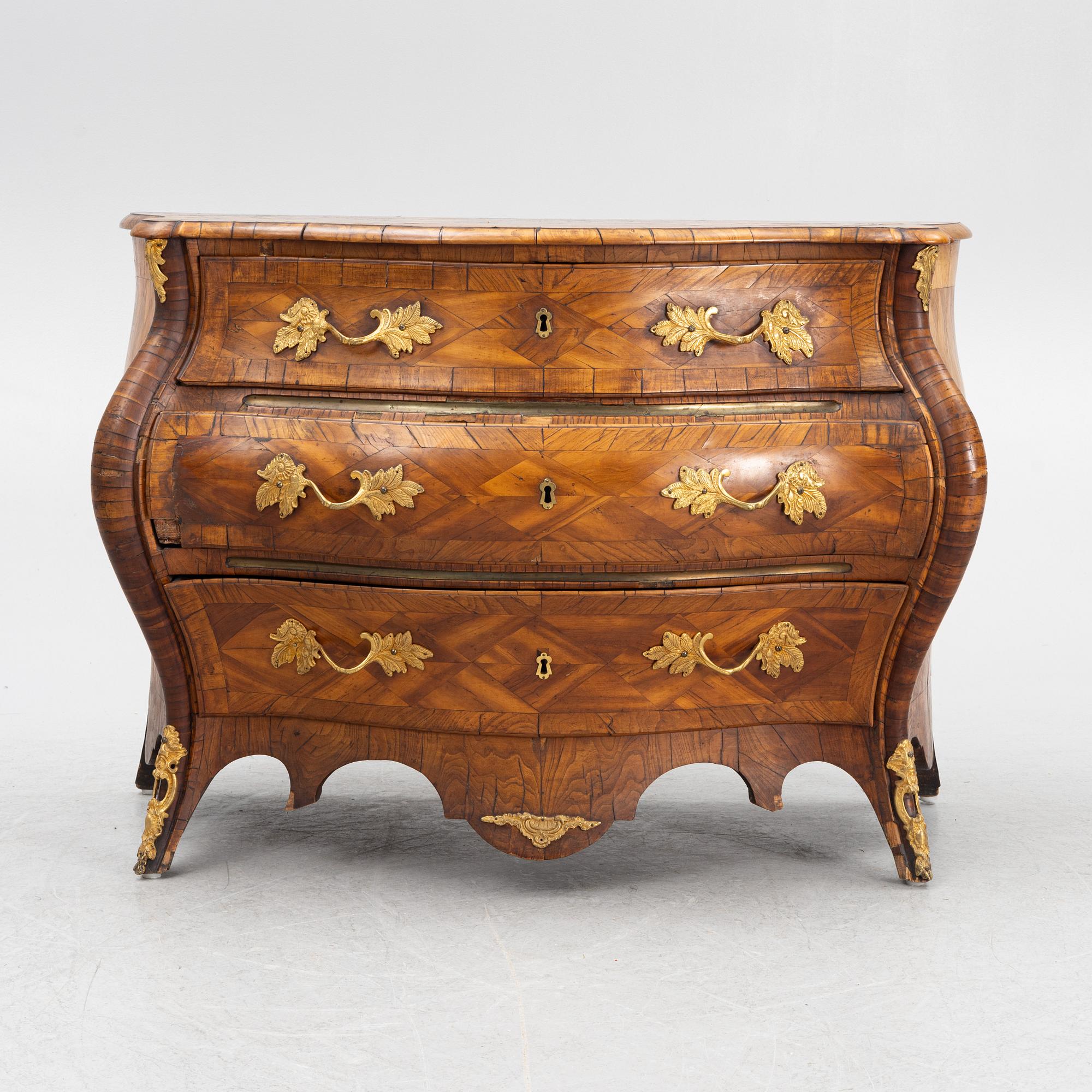 A Swedish rococo parquetry commode, Stockholm, later part of the 18th century.