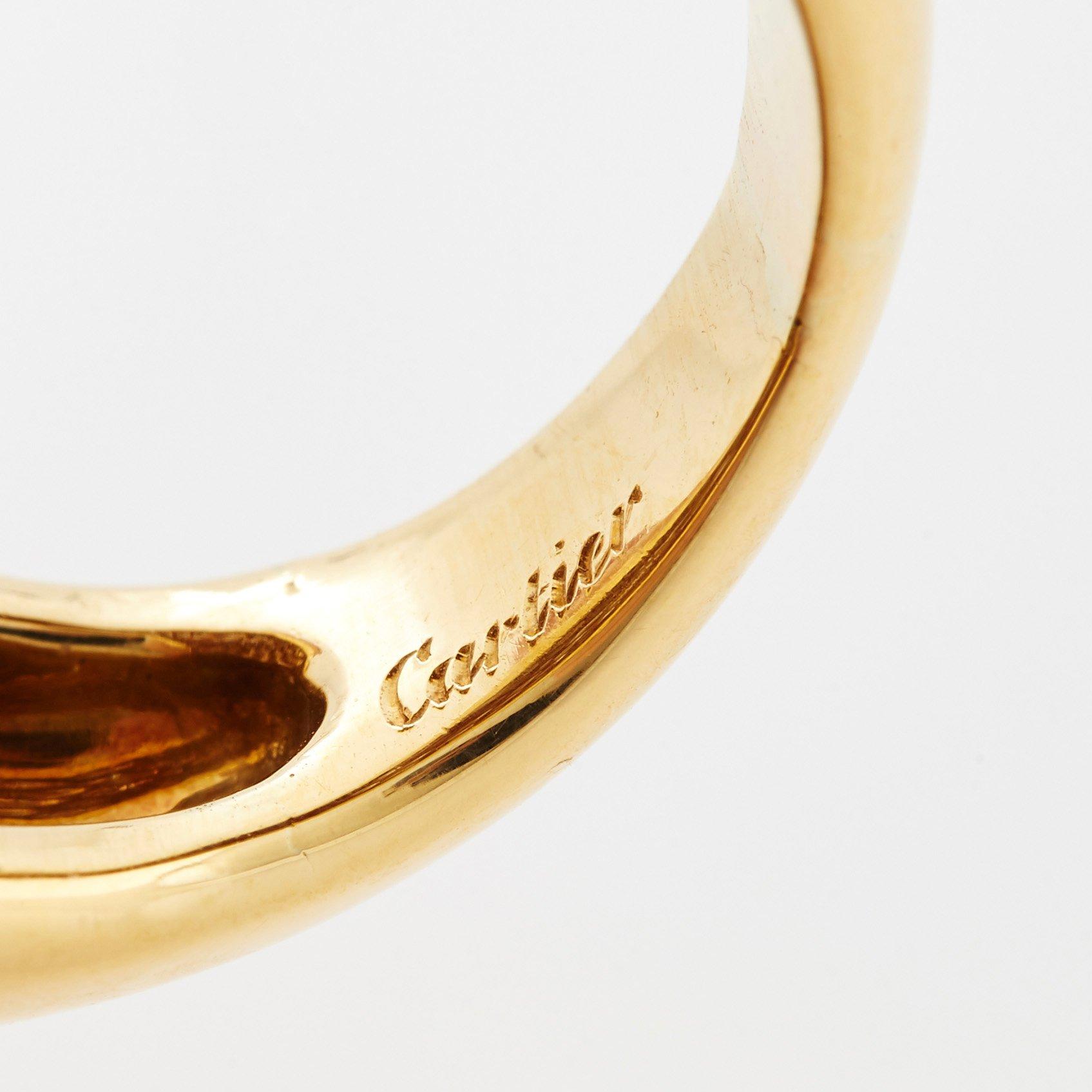 Cartier "Marrakech" an 18K gold bombé ring set with round brilliant-cut diamonds.