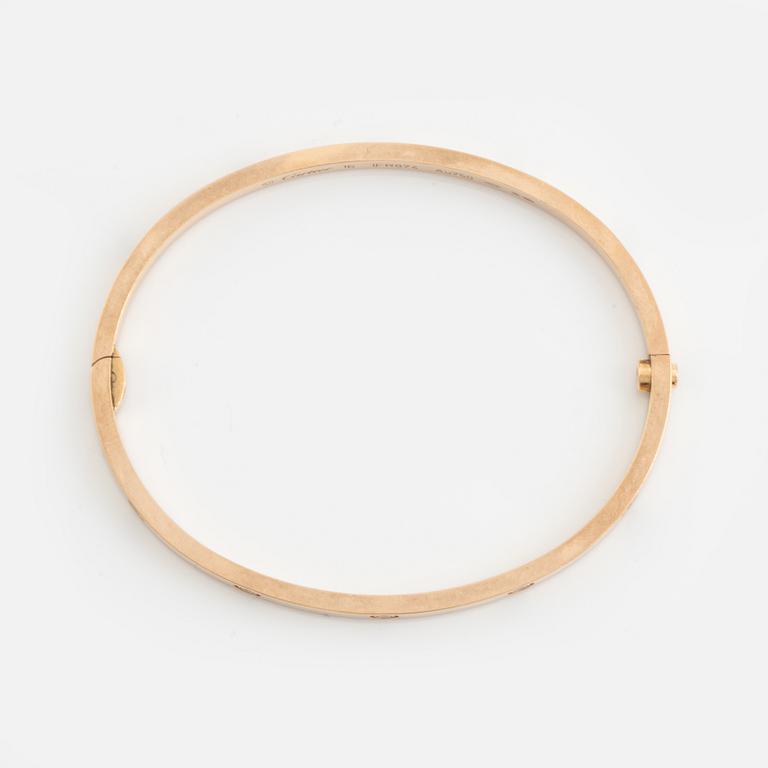 A Cartier "Love" bracelet small model in 18K rose gold with ten round brilliant-cut diamonds.