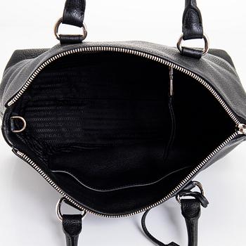 Prada, a leather bag.