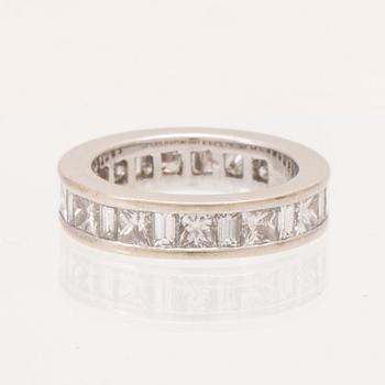An 18K white gold eternity ring set with baguette and princess cut diamonds by Hartmann's Denmark.
