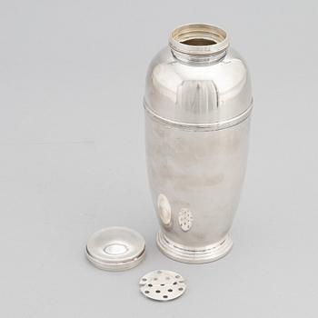 A silver plated shaker, C.G. Hallberg and a set of twelwe cocktail glasses, GAB, second half of the 20th Century.