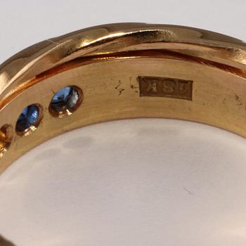 RING, 18k guld med fasettslipade styntetiska stenar. Vikt 11 g.