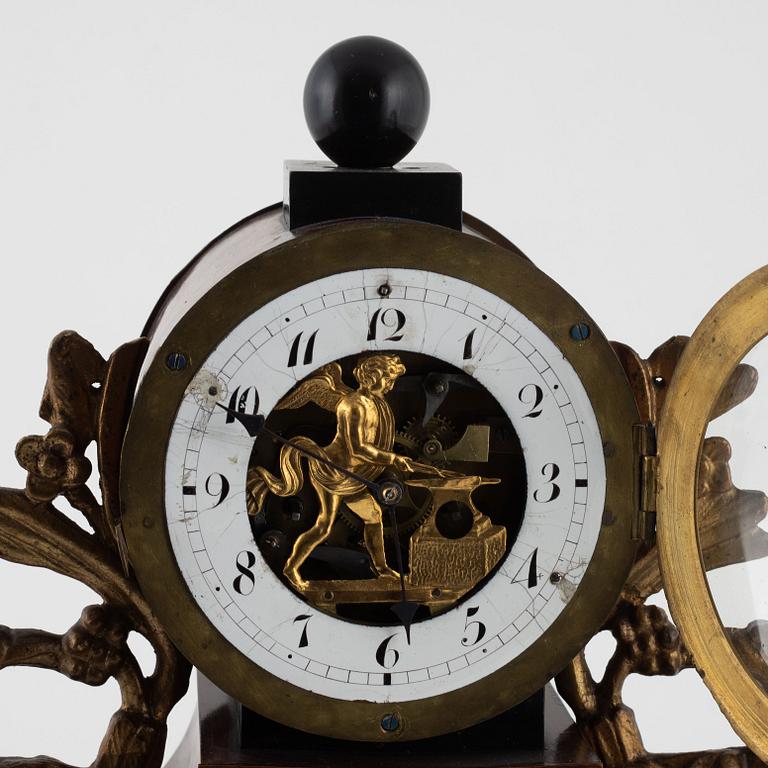 A presumably Austrian mahogany, gilt-brass, and alabaster portico mantel clock, early 19th century.