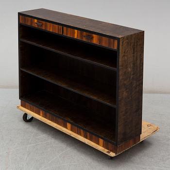 a 1930's stained birch bookshelf.