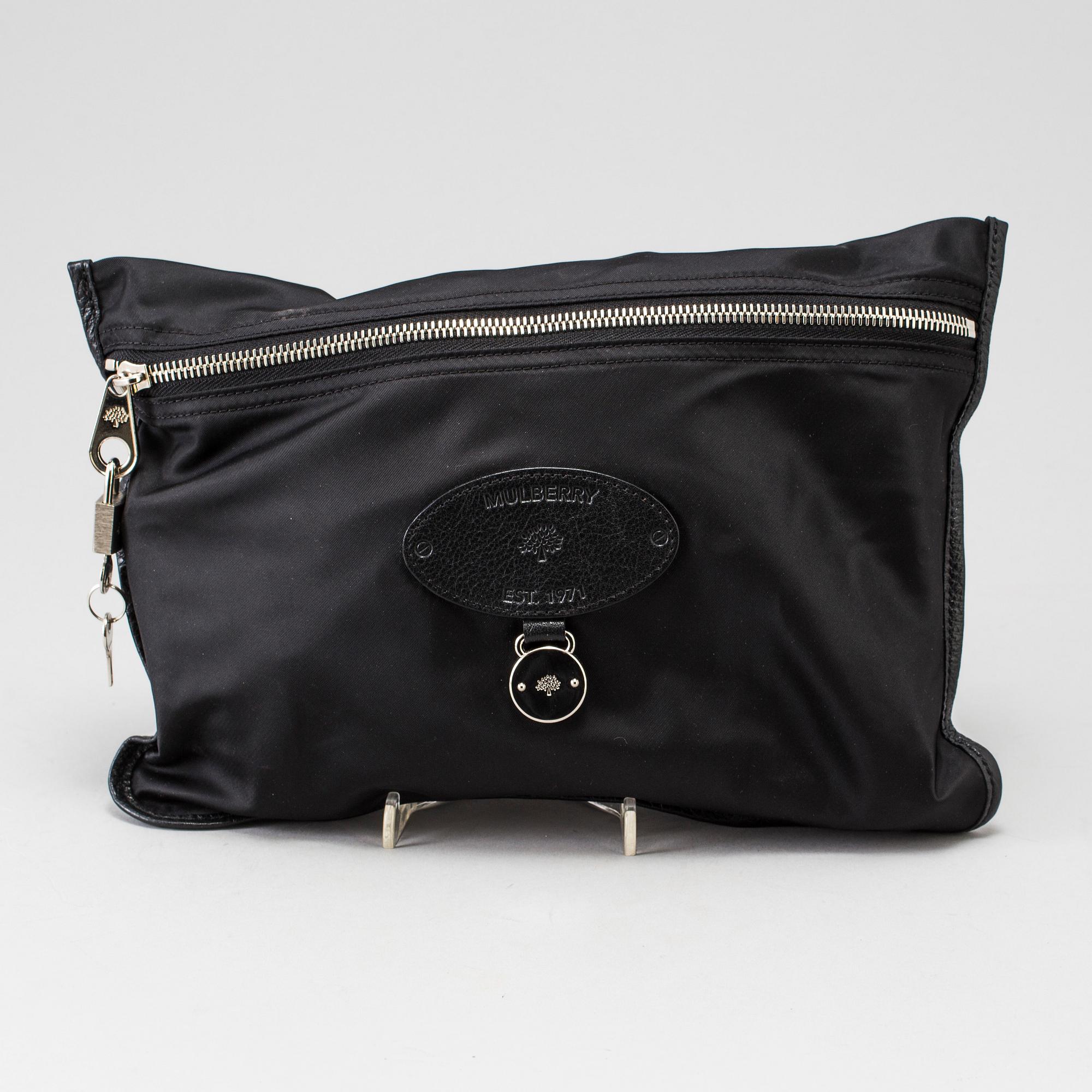 A foldable Mulberry weekend bag.
