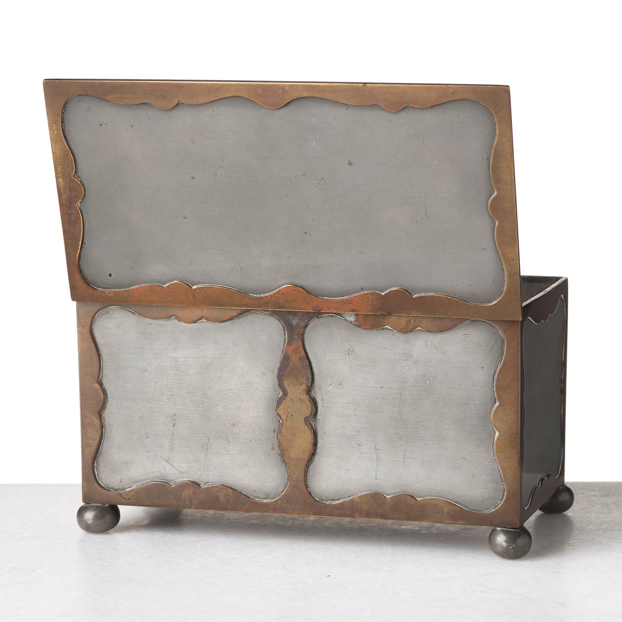 Firma Svenskt Tenn, a pewter and brass box, Stockholm 1930, model A 854.
