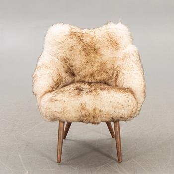 A 1950/60 sheepskin armchair.
