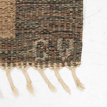 A flat weave carpet, signed, ca. 243 x 165 cm.