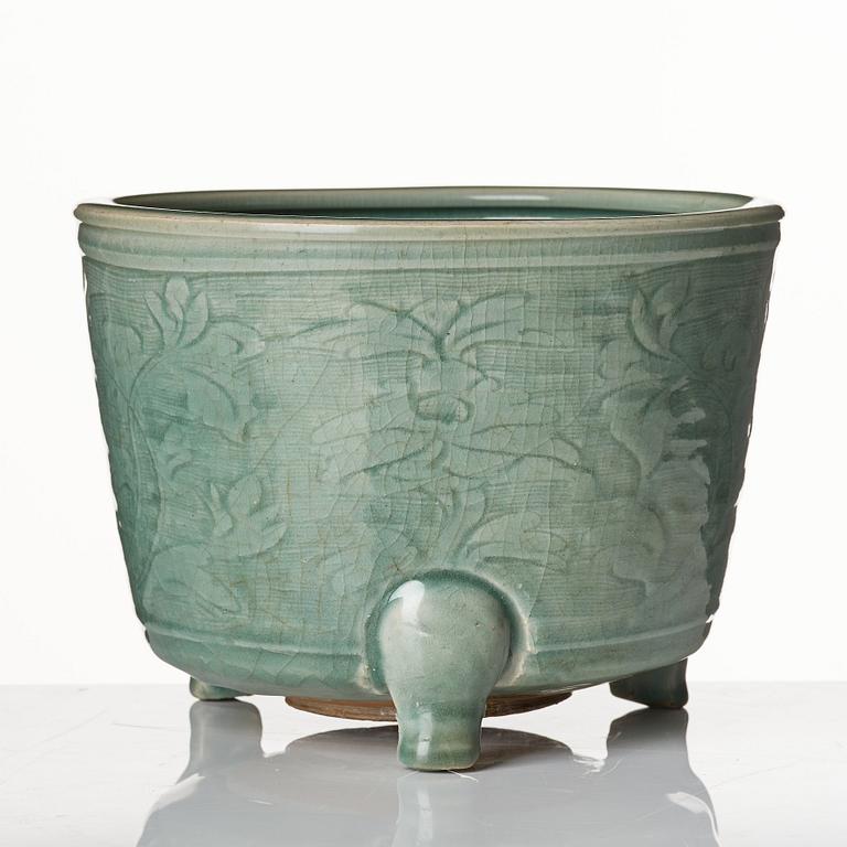 A large celadon tripod censer, Ming dynasty (1368-1644).