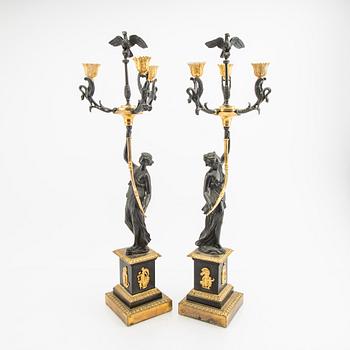 A pair (nearly) of Empire style candelabras later part of the 19th century.