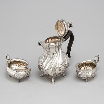 A three-piece silver rococo style coffee service by CG Hallberg, Stockholm, 1948.