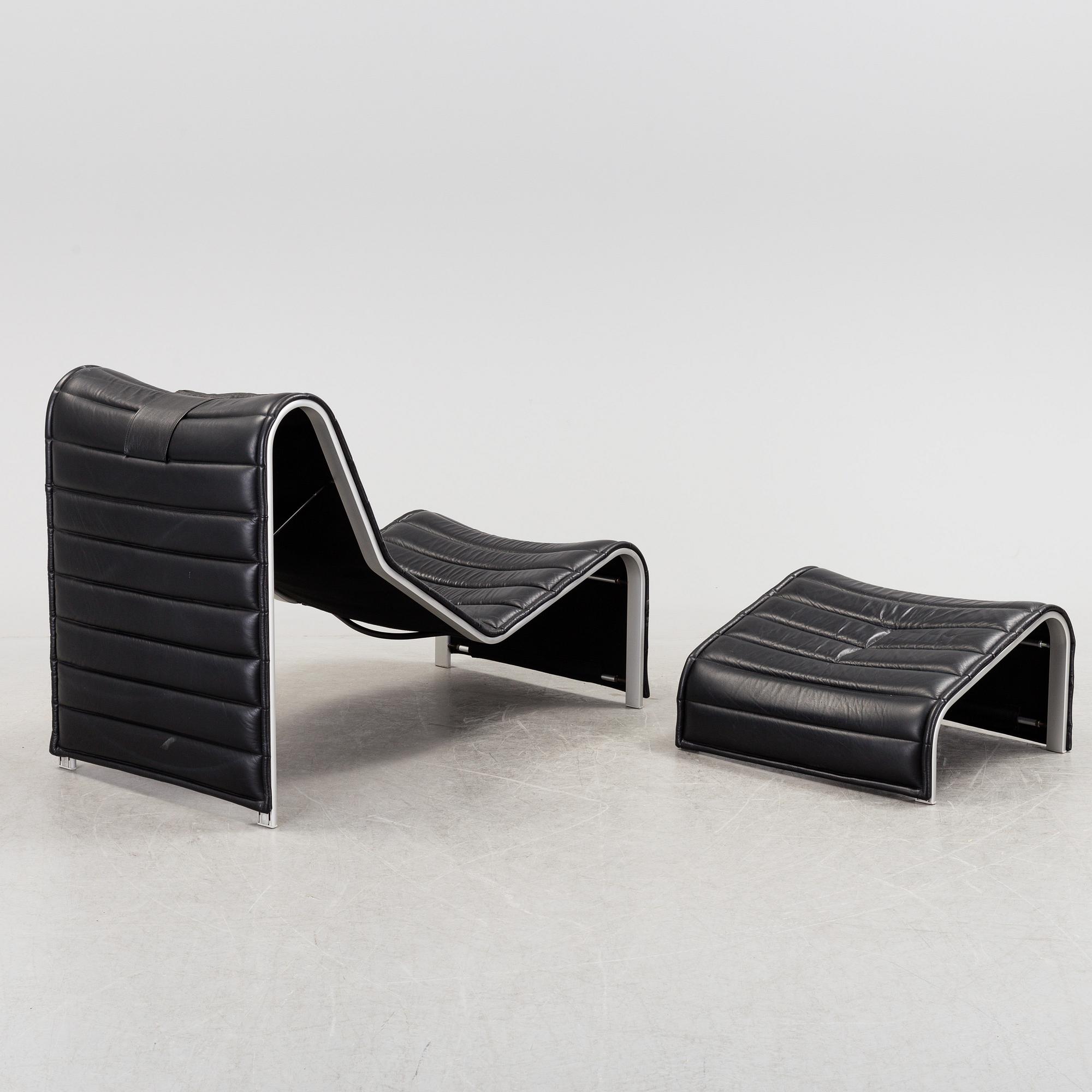 ERIC SIGFRID PERSSON, a leather upholstered lounge chair and foot stool from Möbelkultur AB.