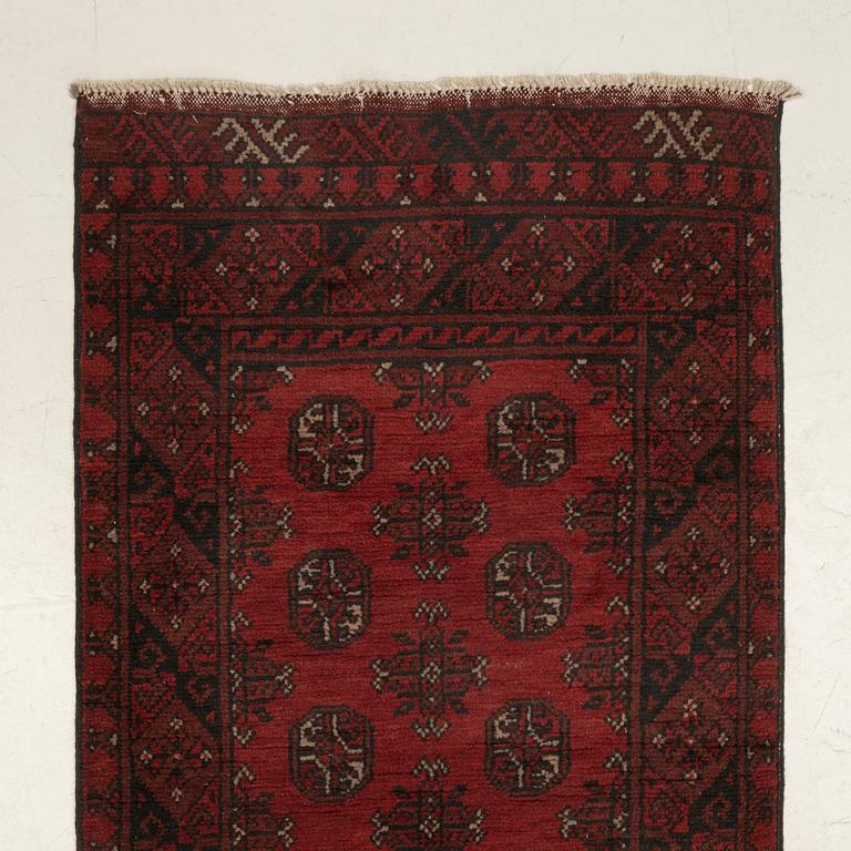 An oriental / Afghan runner, approx. 478 x 81 cm.
