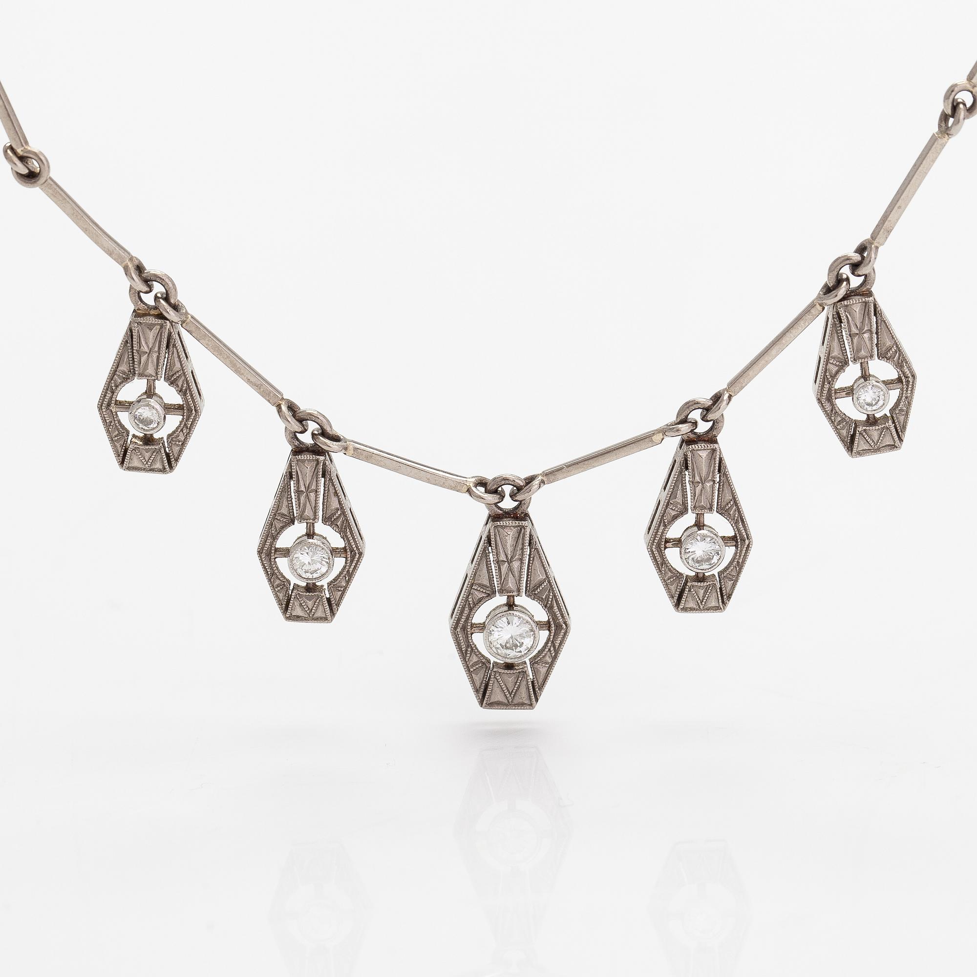 A necklace, ring and earrings, 14K gold and diamonds ca. 0.92 ct in total. Westerback, Helsinki 1964-1973.